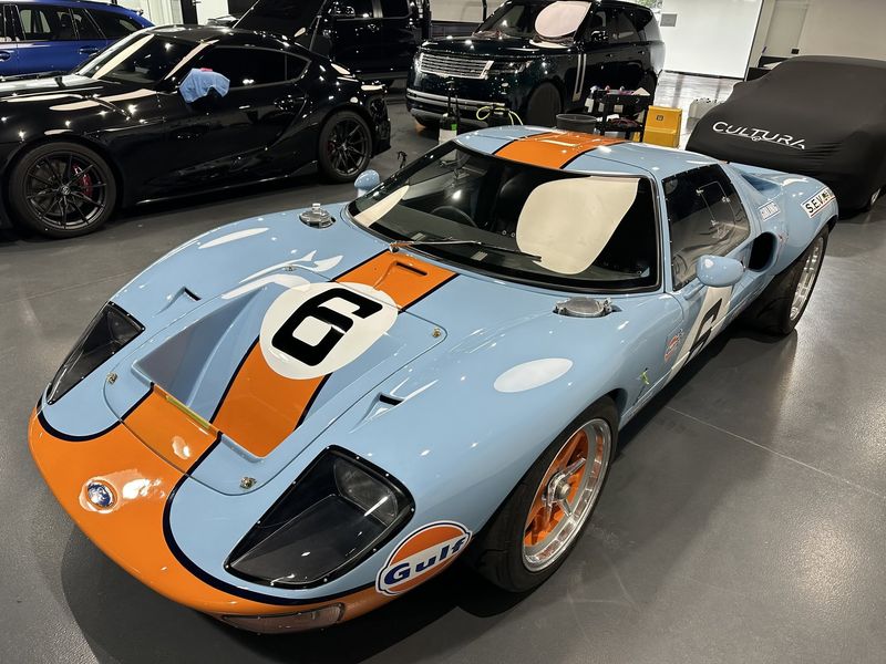 Finished GT40 in heritage blue with a marigold stripe, in the showroom